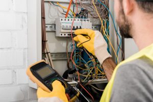 electrician working on a switchboard