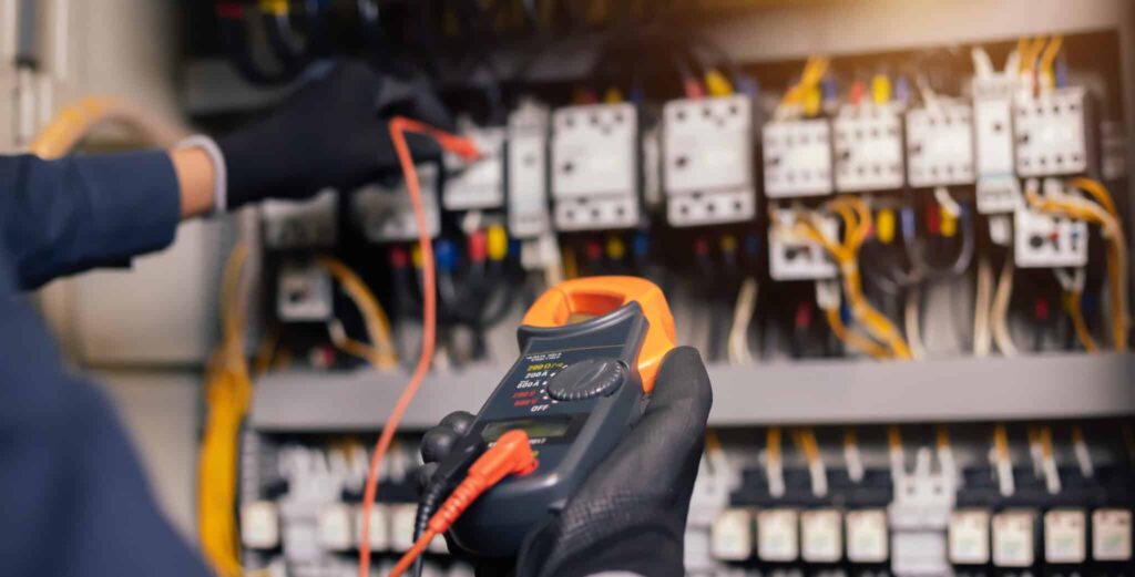 electrician in Jindalee testing powerboard