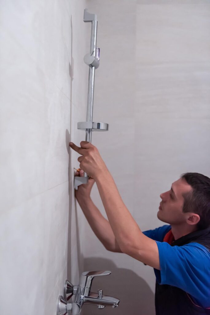 plumber working on bathroom shower